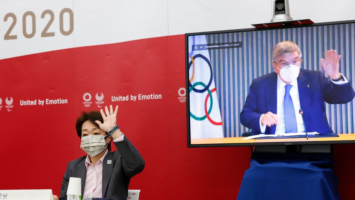 Tokyo 2020 President Seiko Hashimoto and IOC President Thomas Bach on screen, greet each other during a five-party meeting Monday, June 21, 2021