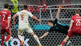 Denmark's Joakim Maehle, second left, scores his side's fourth goal during the match against Russia in Copenhagen, Monday, June 21, 2021