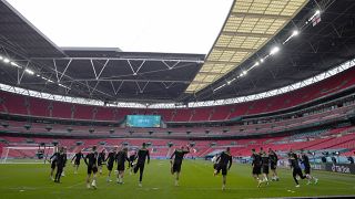 Czech players warm up during a team training session at Wembley stadium in London, June 22, 2021 .