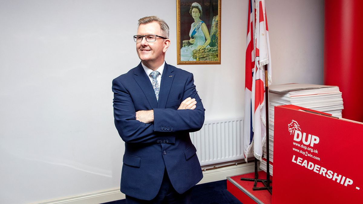 In this file photo taken on May 03, 2021 Democratic Unionist Party (DUP) MP Jeffrey Donaldson poses for a photo at the party's headquarters in Belfast.