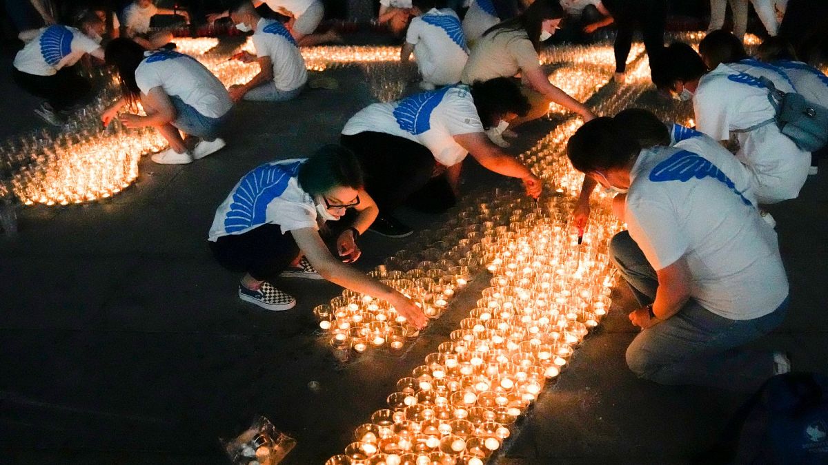 Volunteers light candles marking the 80th anniversary of the Nazi invasion of the Soviet Union at the World War II museum on Poklonnaya Hill in Moscow, Russia.
