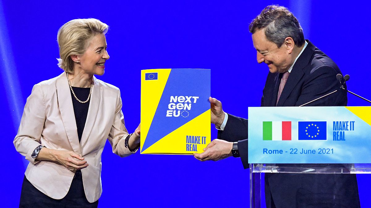 European Commission President, Ursula von der Leyen (L) symbolically hands to Italy's Prime Minister, Mario Draghi the NextGenerationEU recovery plan, on June 22, 2021 in Rome