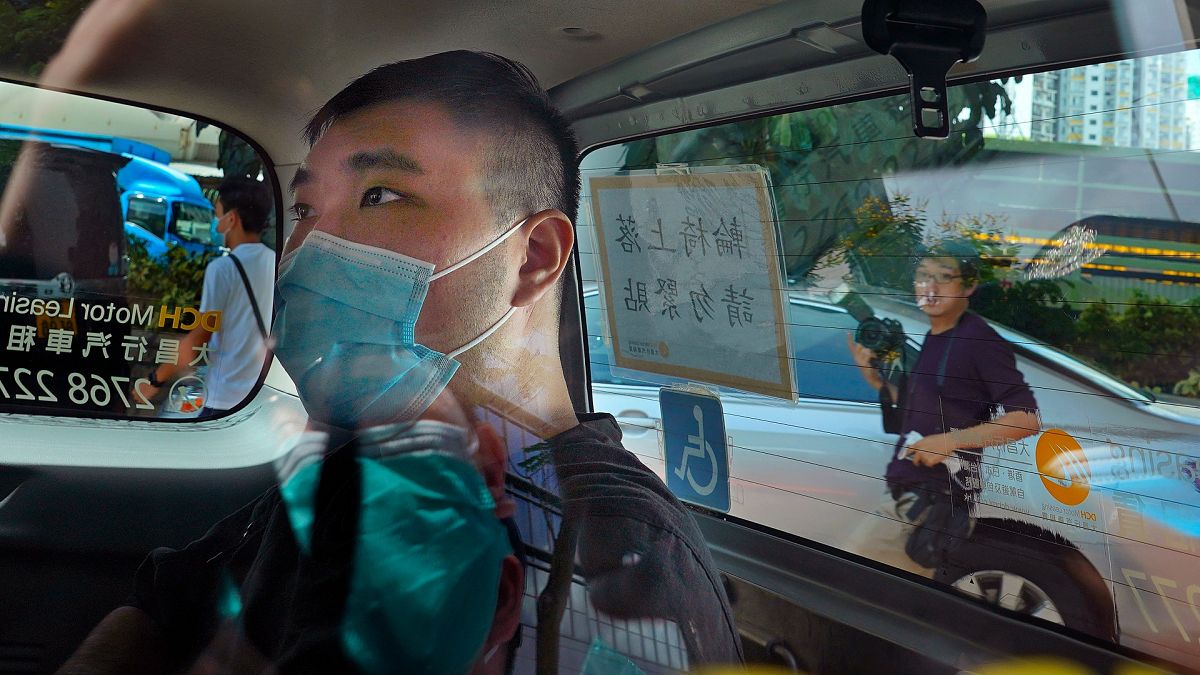 Tong Ying-kit arrives at a court in a police van in Hong Kong, on July 6, 2020.