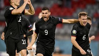 Germany's Leon Goretzka, left, celebrates with teammates after scoring his side's second goal 