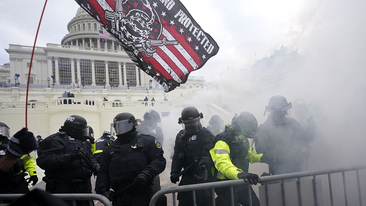 In this Jan. 6, 2021 picture, U.S. Capitol Police officers hold off rioters loyal to President Donald Trump at the Capitol in Washington. 
