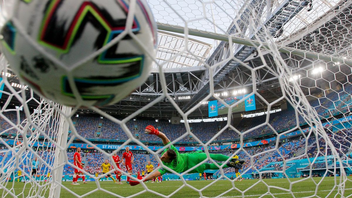 Poland's goalkeeper Wojciech Szczesny fails to make a save during their Euro 2020 match against Sweden in St Petersburg, Russia, on June 23, 2021.