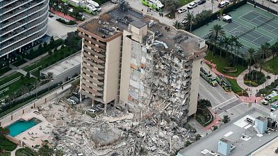 This aerial photo shows part of the 12-story oceanfront Champlain Towers South Condo that collapsed early Thursday, June 24, 2021 in Surfside, Florida.