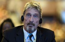 Software entrepreneur John McAfee listens during the 4th China Internet Security Conference (ISC) in Beijing in this file photo from Tuesday, Aug. 16, 2016