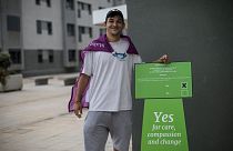 Keilan Schembre, 29, who campaigns for the YES vote during a referendum in Gibraltar, poses for a portrait next a polling station in Gibraltar, Thursday, June, 24, 2021.