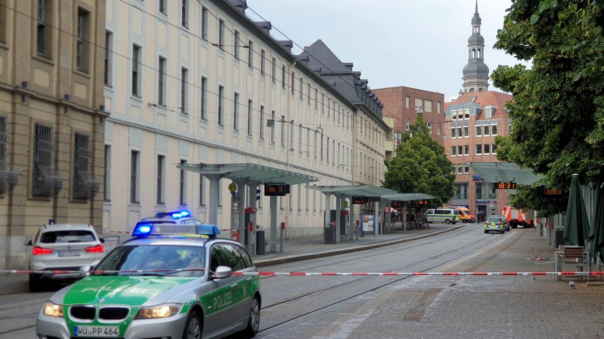 Police cars attend the scene of knife attack in Wuerzburg, Germany, Friday June 25, 2021