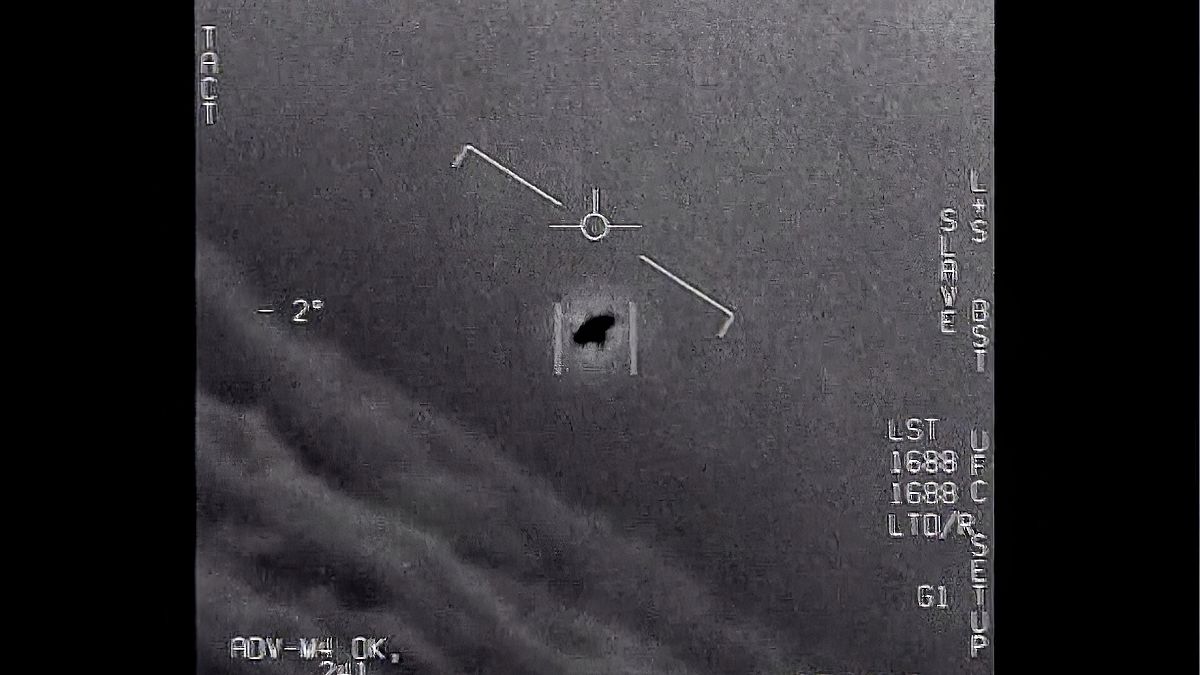 An unexplained object is seen at centre as it is tracked as it soars high along the clouds in footage provided by the US Department of Defence.