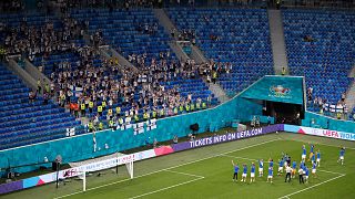 Finland fans applaud fans at the end of the Euro 2020 soccer championship group B match between Finland and Belgium at Saint Petersburg Stadium in St. Petersburg, Russia.