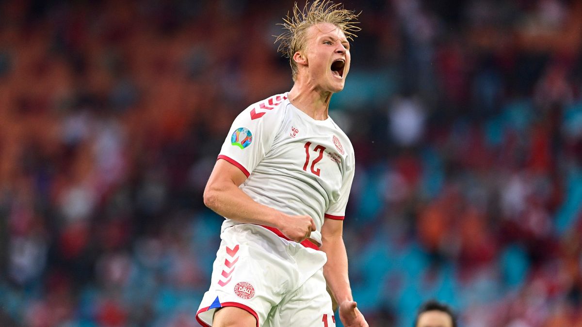 Denmark's Kasper Dolberg celebrates after scoring his side's second goal during the Euro 2020 soccer championship round of 16 match between Wales and Denmark.