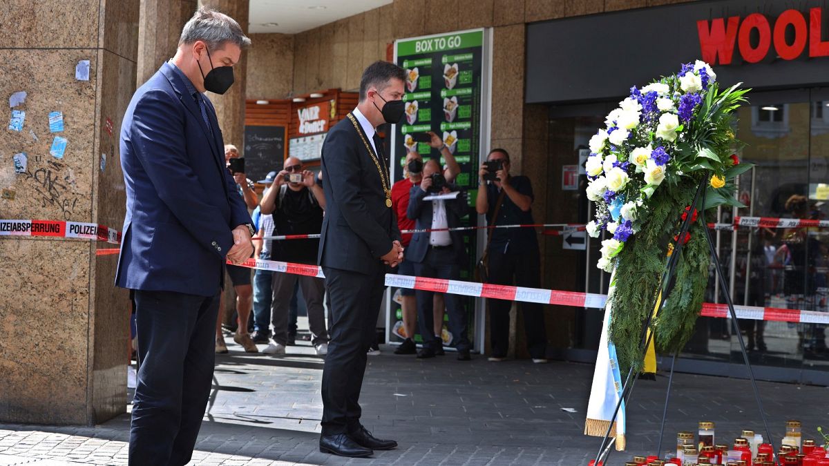 Bavaria's governor Markus Soeder, left, and the mayor of Würzburg, Christian Schuchardt, attend a memorial service in Würzburg, Germany, Sunday, June 27, 2021.