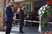 Bavaria's governor Markus Soeder, left, and the mayor of Würzburg, Christian Schuchardt, attend a memorial service in Würzburg, Germany, Sunday, June 27, 2021.