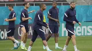 France's Kylian Mbappe warms up during a training session at the National Arena stadium in Bucharest, Romania, Sunday, June 27, 2021.