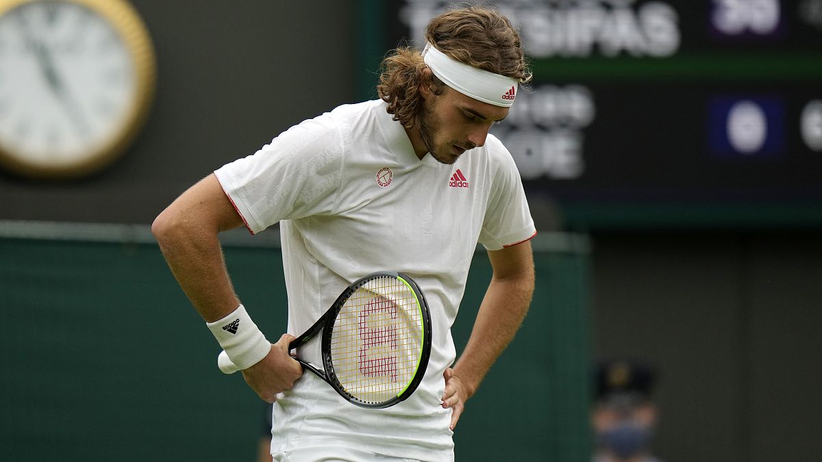 Stefanos Tsitsipas of Greece loses a point to Frances Tiafoe of the US during the men's singles match on day one of the Wimbledon Tennis Championships in London