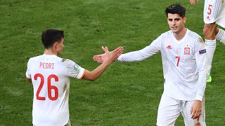 Spain's Alvaro Morata celebrates with his teammate Pedri 