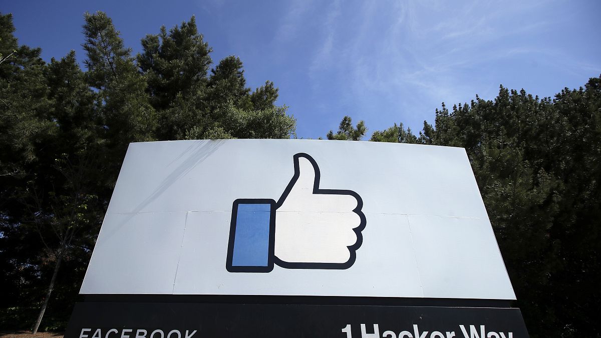In this April 14, 2020 file photo, the thumbs up Like logo is shown on a sign at Facebook headquarters in Menlo Park, California.