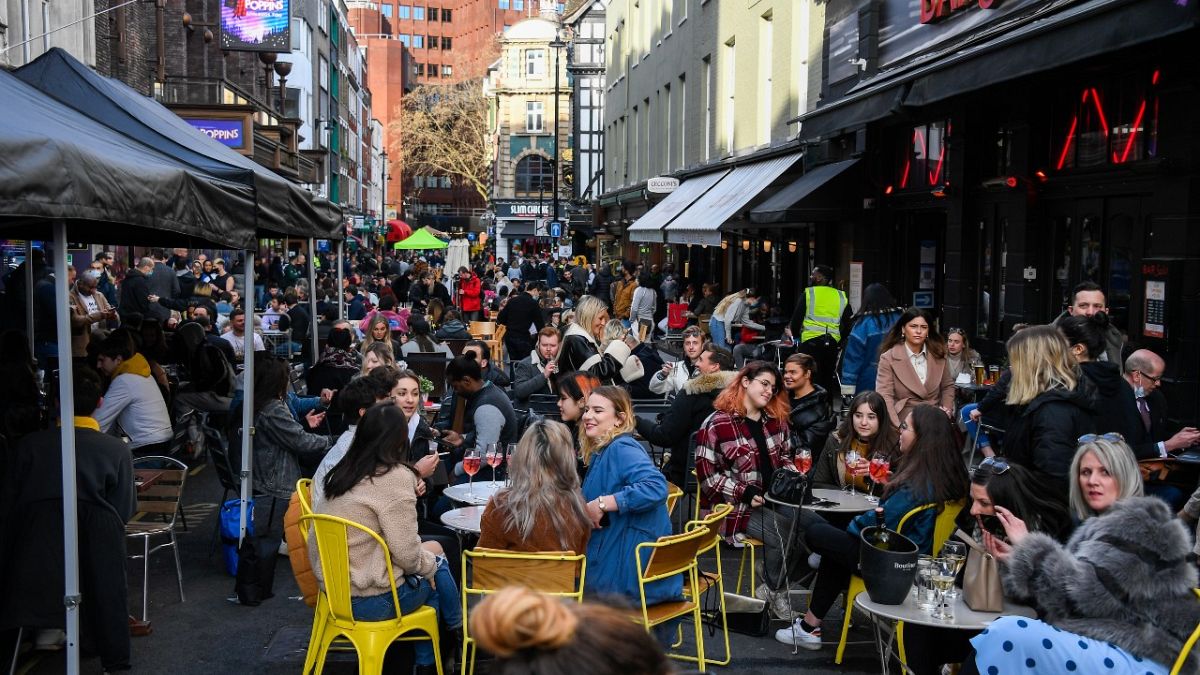 Outside cafes and pubs in Soho, central London, on the day some of England's coronavirus lockdown restrictions were eased by the British government, April 12, 2021.