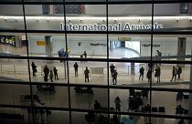 Passengers pictured in the arrivals area at Heathrow Airport in London.