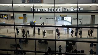 Passengers pictured in the arrivals area at Heathrow Airport in London.