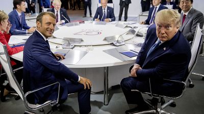 French President Emmanuel Macron, center left, and President Donald Trump, centre right, participate in a G-7 Working Session on the Global Economy.