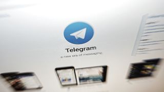 The website of the Telegram messaging app is seen on a computer's screen.