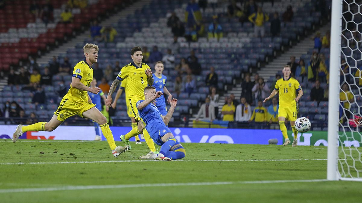 Ukraine's Artem Dovbyk scores his team's winning goal during the Euro 2020 round of 16 match between Sweden and Ukraine at Hampden Park in Glasgow, Tuesday, June 29, 2021.
