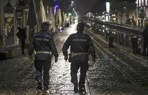 Two city police officers patrol the Navigli area of Milan.