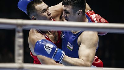 Kazakhstan's Kamshybek Kunkabayev (R) fights with Uzbekistan's Bakhodir Jalolov during the AIBA men's super heavy weight final in Yekaterinburg, Russia, Sept. 21, 2019.