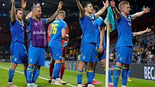 Ukraine's players celebrate their victory in the Euro 2020