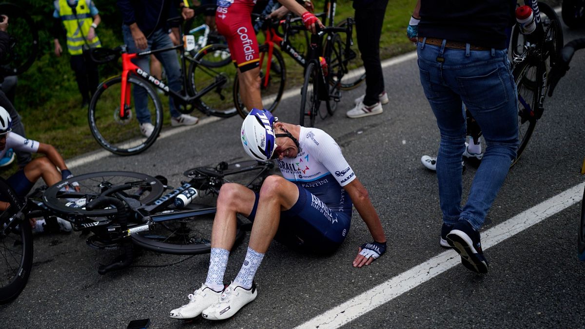 Britain's Chris Froome lays on the road after crashing during the first stage of the Tour de France cycling race over 197.8 kilometres 26 June 2021.