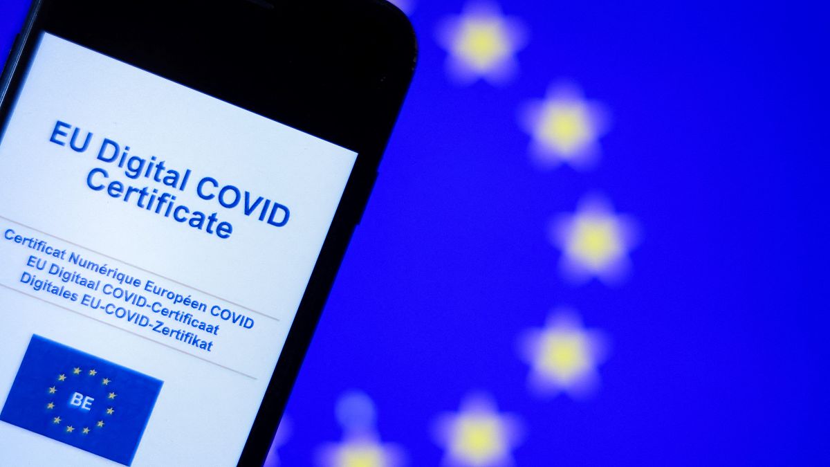 A picture taken on June 16, 2021 in Brussels shows the screen of a mobile phone bearing a EU Digital Covid certificate. 