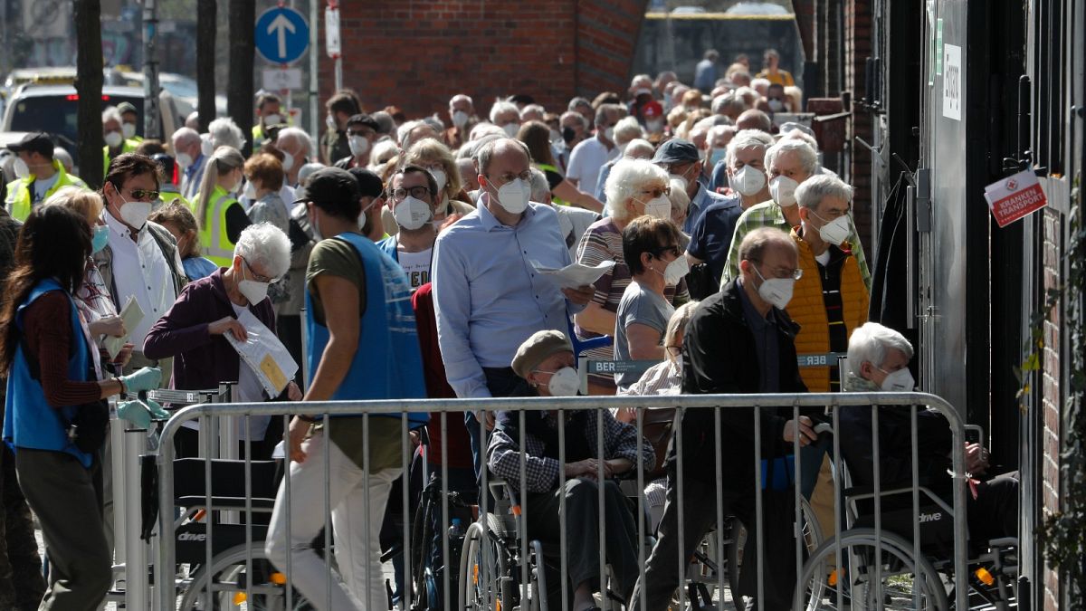 People line up in front of the vaccination centre at the Arena Treptow in Berlin, Germany, March 31, 2016.