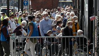 People line up in front of the vaccination centre at the Arena Treptow in Berlin, Germany, March 31, 2016.