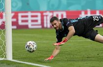 Spain's goalkeeper Unai Simon dives for a save during the Euro 2020 championship quarterfinal match between Switzerland and Spain in Saint Petersburg.