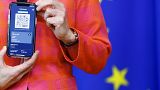 European Commission President Ursula von der Leyen shows a digital COVID-19 certificate at a press conference in June.