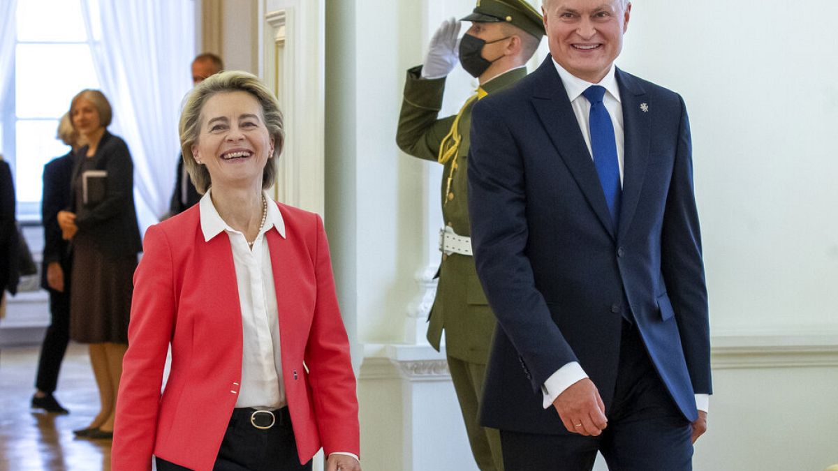 Lithuania's President Gitanas Nauseda and European Commission President Ursula von der Leyen, left, arrive for their meeting at the Presidential palace in Vilnius, Lithuania, 