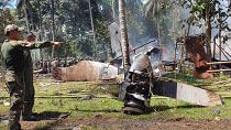 Parts of a Lockheed C-130 Hercules plane at the crash site in Patikul town, Sulu province