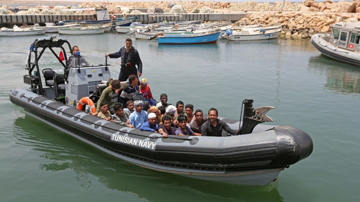 Migrants rescued by Tunisia's national guard from the Mediterranean arrive at the port of el-Ketef near the Libyan border, June 27, 2021. 