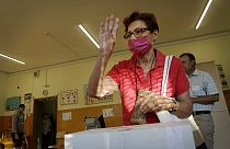 A woman reacts after casting her vote in Sofia on Sunday