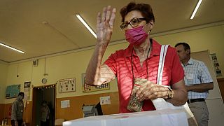 A woman reacts after casting her vote in Sofia on Sunday