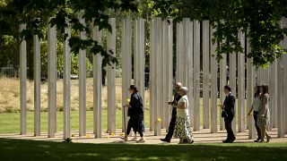 Australia's Gill Hicks, left, who lost both her legs, during a service to mark the 10th anniversary of the 7/7 London attacks, at the 7/7 memorial in Hyde Park, July 7, 2015.