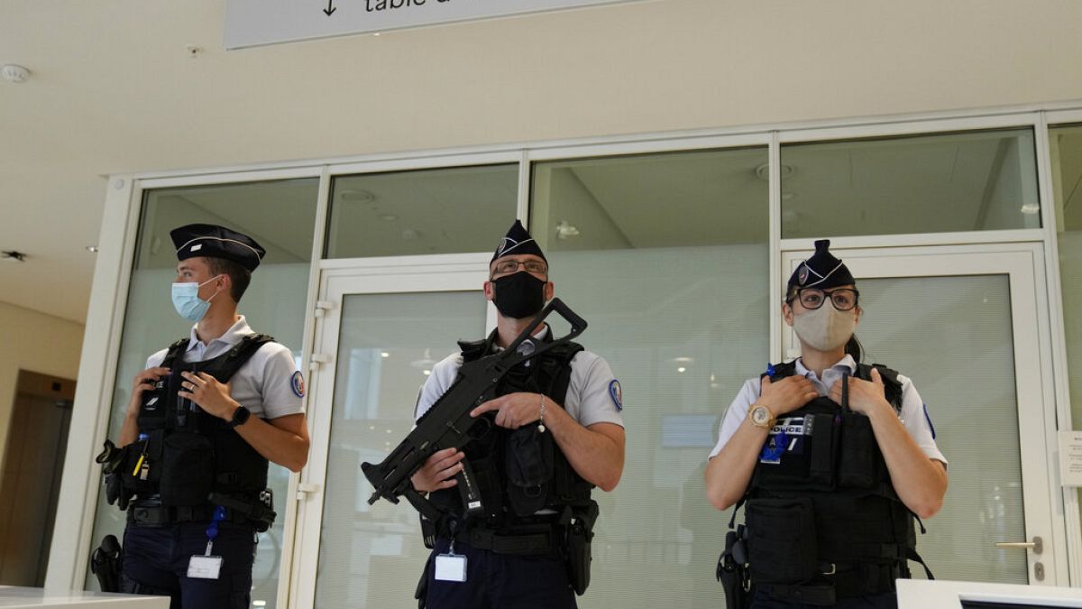 FILE PHOTO: Police officers guard the Palace of Justice Thursday, June 3, 2021 in Paris, France.  
