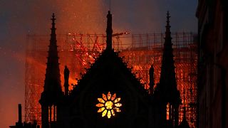 Flames and smoke rise from Notre Dame cathedral as it burns in Paris, Monday, April 15, 2019. 