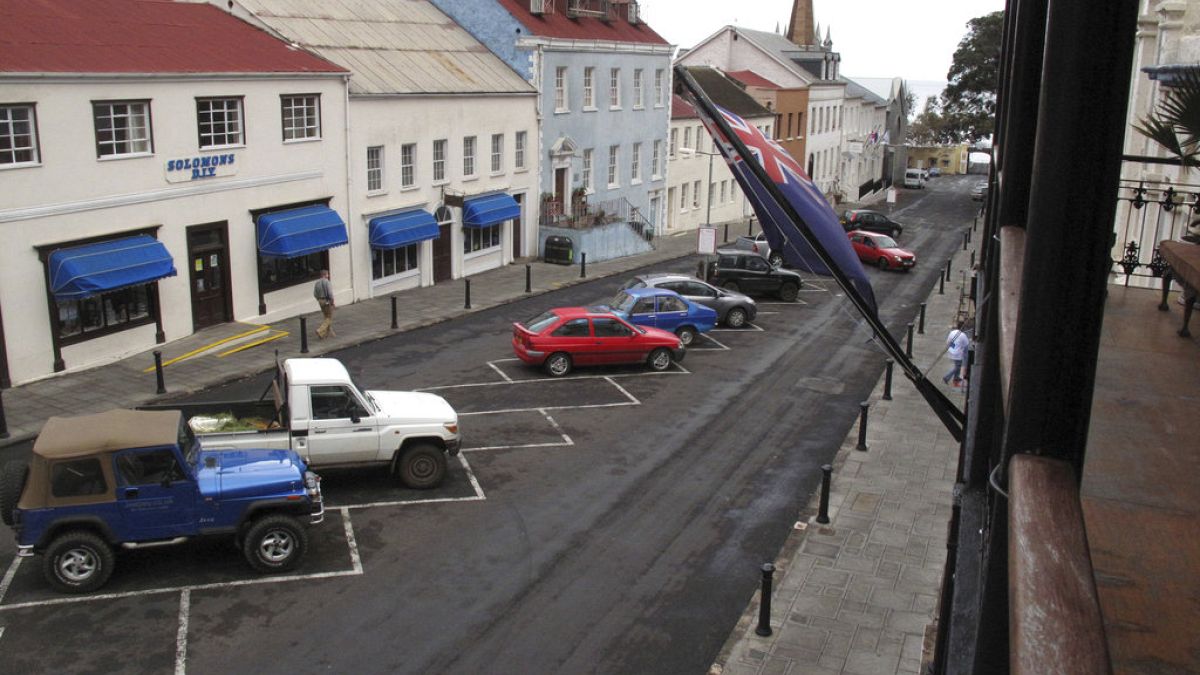 FILE: Vehicles are parked along a neat row in downtown Jamestown, capital of St. Helena island, 2017.
