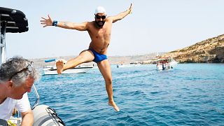 Neil Agius dives off for his world-record breaking swim.