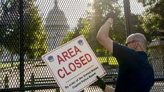 Barricades come down on US Capitol as threat level lowered