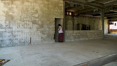  Devla Ajsic walking inside former Dutch U.N. compound where she survived sexual abuse in July 1995